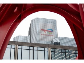 Signage for TotalEnergies SE at the company's headquarters in the La Defense business district in Paris, France, on Friday, Oct. 14, 2022. TotalEnergies called for all strikes to end as two unions, which together represent a majority of workers, agreed to an offer of a 7% increase in 2023, the CGT union rejected the deal demanding a 10% raise. Photographer: Benjamin Girette/Bloomberg