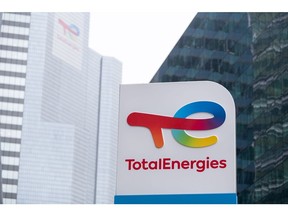Signage for TotalEnergies SE at the company's headquarters in the La Defense business district in Paris, France, on Friday, Oct. 14, 2022. TotalEnergies called for all strikes to end as two unions, which together represent a majority of workers, agreed to an offer of a 7% increase in 2023, the CGT union rejected the deal demanding a 10% raise. Photographer: Benjamin Girette/Bloomberg