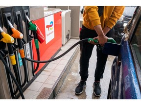 A customer refuels his vehicle at TotalEnergies gas station in Paris, France, on Friday, Oct. 14, 2022. TotalEnergies called for all strikes to end as two unions, which together represent a majority of workers, agreed to an offer of a 7% increase in 2023, the CGT union rejected the deal demanding a 10% raise. Photographer: Benjamin Girette/Bloomberg