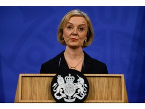 Liz Truss, UK prime minister, during a news conference on the UK economy at Downing Street in London, UK, on Friday, Oct. 14, 2022. Truss fired Chancellor of the Exchequer Kwasi Kwarteng and replaced him with former Foreign Secretary Jeremy Hunt as she prepared to make a humiliating U-turn on parts of her economic plan.
