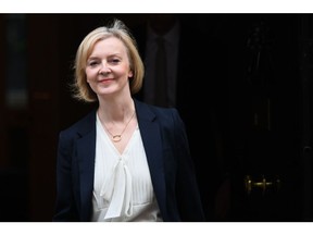 Liz Truss, UK prime minister, departs 10 Downing Street on her way to attend a weekly questions and answer session in Parliament in London, UK, on Wednesday, Oct. 19, 2022. Embattled Truss faces a brewing parliamentary rebellion if she is forced to abandon a key Conservative manifesto commitment on pensions as part of a frantic austerity drive.