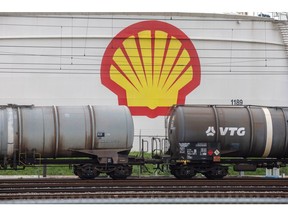The logo of Shell Plc on a oil storage silo, beyond railway tanker wagons at the company's Pernis refinery in Rotterdam, Netherlands, on Sunday, Oct. 23, 2022. Shell reports earnings on Oct. 27. Photographer: Peter Boer/Bloomberg