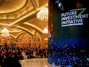 Attendees watch a broadcast in a hall at the Future Investment Initiative (FII) conference in Riyadh, Saudi Arabia, on Tuesday, Oct. 25, 2022. Saudi Arabia hopes the FII will put Riyadh on the map as a global destination for deals, while also improving domestic investment, which has been limited. Photographer: Tasneem Alsultan/Bloomberg