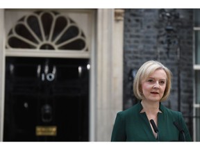 Liz Truss, outgoing UK prime minister, delivers her leaving speech outside 10 Downing Street in London, UK, on Tuesday, Oct. 25, 2022. Rishi Sunak, whose first name means a sage in Hindi, will become the UK's youngest prime minister in more than two centuries and its first from an ethnic minority and also be the first former hedge funder to hold the post.