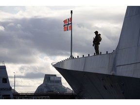 A soldier guards the deck of Royal Norwegian Navy Fridtjof Nansen-class warship HMoMS Roald Amundsen (F311), part of the Standing NATO Maritime Group, at the passenger port in Riga, Latvia, on Sunday, Oct. 30, 2022. For the Baltics, Moscow will remain a threat in eastern Europe regardless of the outcome of the war, with no indication that Kremlin's foreign policy will change, Mikk Marran, Estonia's outgoing espionage chief, said. Photographer: Andrey Rudakov/Bloomberg