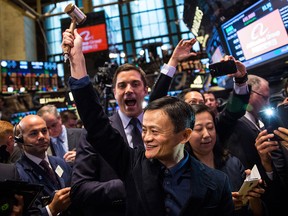 Founder of Alibaba Group Jack Ma celebrates as the stock goes live during the company's initial price offering at the New York Stock Exchange in September, 2014. The Canada Pension Plan Investment Board sold all its U.S.-listed shares in the Chinese tech giant this summer.