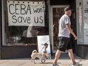 A business in Toronto displays a sign saying 'CEBA Won’t Help Us' during the height of the COVID-19 pandemic in 2020. The government has extended the deadline for repaying pandemic aid. 
