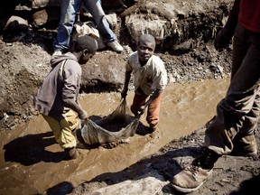 Children wash copper at a mine in the Democratic Republic of Congo, in 2010.