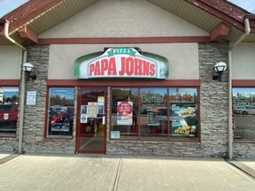 The first Papa Johns Location in Canada opens in Calgary, Alberta, June 12, 2000.