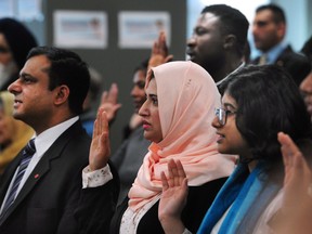 New Canadians participate in a citizenship ceremony in B.C., in 2018.