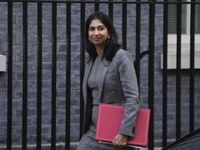 FILE - Suella Braverman, Britain's Home Secretary arrives for a cabinet meeting at 10 Downing Street in London, Oct. 18, 2022. British Home Secretary Suella Braverman left her job on Wednesday Oct. 19, 2022, the second senior minister in a week to leave Prime Minister Liz Truss' government.