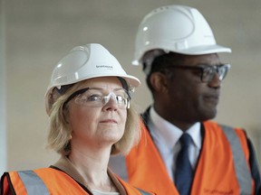 British Prime Minister Liz Truss and Chancellor of the Exchequer Kwasi Kwarteng visit a construction site for a medical innovation campus in Birmingham, on day three of the during day three of the Conservative Party annual conference at the International Convention Centre in Birmingham, England, Tuesday, Oct. 4, 2022.
