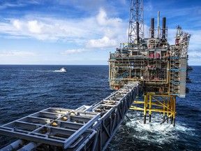 FILE - The Sleipner A gas platform, Norway, Oct. 1, 2022 as a Coast Guard ship patrols around the platform. Norwegian oil and gas workers normally don't see anything more threatening than North Sea waves crashing against the steel legs of their offshore platforms. But lately they have noticed a more troubling sight: unidentified drones buzzing in the skies overhead.