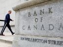Bank of Canada Governor Tiff Macklem walks outside the Bank of Canada building in Ottawa.