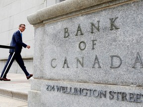 Governor of the Bank of Canada Tiff Macklem walks outside the Bank of Canada building in Ottawa.