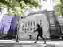 A woman walks past the Bank of Canada headquarters in Ottawa.