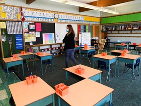 A teacher walks through her classroom at Hunter's Glen Junior Public School in Scarborough, Ont.