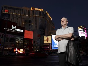 FILE - Jeff German poses on the Strip in Las Vegas, on June 2, 2021. Clark County District Judge Susan Johnson granted a Las Vegas Journal-Review order, Tuesday, Oct. 11, 2022, blocking immediate review by prosecutors and defense attorneys of slain reporter German's cellphone and electronic devices, that could include source names and unpublished work, at least until she crafts a way for the records to be screened by a neutral third-party. The Las Vegas Review-Journal demanded that authorities don't review German's reporting materials and electronic devices, which were seized by authorities after his death. T.