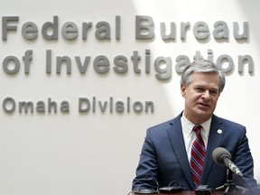 FILE - FBI Director Christopher Wray speaks during a news conference on Aug. 10, 2022, in Omaha, Neb. The White House is bringing together three dozen nations, the European Union and a slew of private-sector companies for a two-day summit starting Monday, Oct. 31, 2022, that looks at how best to combat ransomware attacks. Several administration officials are planning to participate in the event, including Wray. President Joe Biden was not expected to attend.