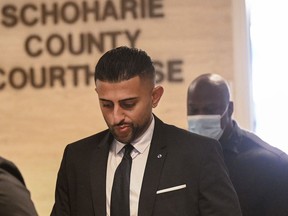 FILE - Nauman Hussain, the operator of a limousine company involved in a crash that killed 20 people in upstate New York, leaves the Schoharie County Courthouse Wednesday, Aug. 31, 2022, in Schoharie, NY Regulators in New York failed to do all they could to shelve a poorly maintained stretch limo that rolled down a hill and crashed in 2018 killing 20 people, a dog says state guard, Friday, October 28, 2022.