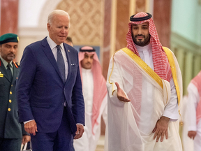 U.S. President Joe Biden and Saudi Crown Prince Mohammed bin Salman met this summer in Riyadh. Biden's government has threatened unspecified "consequences" if OPEC+ goes ahead with oil output cuts announced last week.