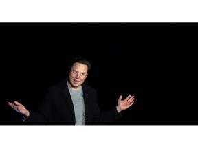 Elon Musk gestures as he speaks during a press conference at SpaceX's Starbase facility near Boca Chica Village in South Texas on February 10, 2022.