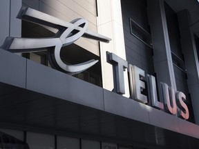 The sign on the front of the Telus head office is shown in Toronto on Thursday, February 11, 2021.