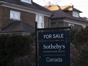 A real estate sale sign is shown in a west-end Toronto neighbourhood Saturday, March 7, 2020.