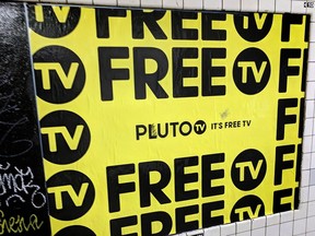 An advertisement for Pluto TV is displayed on the wall of a subway station in New York, March 14, 2019.