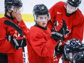 Canada's National Junior Team defenceman Jack Thompson looks on during a training camp practice in Calgary, Tuesday, Aug. 2, 2022. Bauer Hockey is putting its partnership with Hockey Canada on ice, calling the repeated breach of trust by the national sport organization's leadership "extremely disturbing."