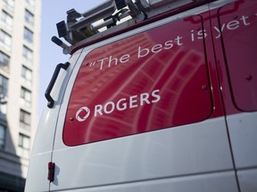 A Rogers Communications Inc. service van sits parked in Toronto.