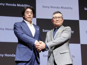 Izumi Kawanishi, left, the Sony executive who became Chief Operating Officer at Sony Mobility and Chief Executive Yasuhide Mizuno pose for a photo during a news conference in Tokyo Thursday, Oct. 13, 2022. A new electric car company that brings together two big names in Japanese business, Honda and Sony, officially kicked off Thursday, with both sides stressing their common values of taking up challenges and serving people's needs.