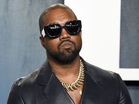 FILE - Kanye West arrives at the Vanity Fair Oscar Party on Feb. 9, 2020, in Beverly Hills, Calif. The rapper formerly known as Kanye West is offering to buy right-wing friendly social network Parler after being booted off of Twitter and Instagram.