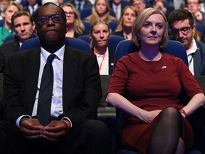 Kwasi Kwarteng, seen here with UK Prime Minister Liz Truss, has resigned as Britain's Chancellor of the Exchequer.