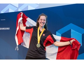 Korae Nottveit, 23, of Calgary, Alberta celebrates winning a gold medal in Cooking at the WorldSkills Competition 2022 Special Edition in Lucerne, Switzerland.