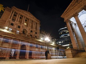 Traffic outside the Bank of England, in the financial district in the City of London, Monday, Oct. 17, 2022. The U.K.'s new Treasury chief ripped up the government's economic plan on Monday, dramatically reversing most of the tax cuts and spending plans that new Prime Minister Liz Truss announced less than a month ago.