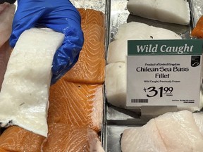 FILE - Fillets of Chilean sea bass caught near the U.K.-controlled South Georgia island are displayed for sale at a Whole Foods Market in Cleveland, Ohio, June 17, 2022. Southern Cross Seafoods said in a complaint filed in Oct. 2022 in the U.S. International Trade Court that the decision to bar importation of Chilean sea bass was arbitrary, illegal and would cause significant economic harm to its business.