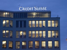 FILE- The logo of Credit Suisse is seen at a building in the Brunau quarters in Zurich, Switzerland, Tuesday, Dec. 9, 2008. Swiss banking giant Credit Suisse has agreed to pay the French government 238 million euros in a tax fraud settlement deal announced Monday.