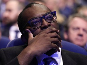 Britain's Chancellor of the Exchequer Kwasi Kwarteng listens to Britain's Prime Minister Liz Truss making a speech at the Conservative Party conference at the ICC in Birmingham, England, Wednesday, Oct. 5, 2022.