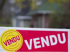 A real estate sold sign is shown on the west island of Montreal on November 4, 2017.