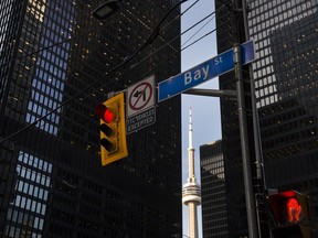A red light on Bay Street in Canada's financial district is shown in Toronto on Wednesday, March 18, 2020.