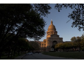The Texas State Capitol building stands in Austin, Texas, U.S., on Tuesday, March 14, 2017. Austin has spent the last 10 months engaged in a big experiment in urban transportation. Several hundreds of thousands of people will descend upon Austin for the annual South by Southwest festival, a nine-day event that could be described as a tech conference, a music and film festival. Photographer: David Paul Morris/Bloomberg