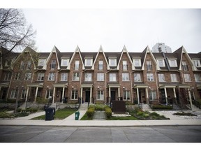 Houses stand in Toronto, Ontario, Canada, on Thursday, May 11, 2017. Toronto home prices climbed 5 percent in April, suggesting the Ontario government's foreign buyer tax and troubles at Home Capital Group Inc. haven't yet cooled the market.