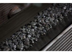 Copper-nickel ore moves along a conveyor belt at the Talnakh concentrator plant, operated by MMC Norilsk Nickel PJSC, in Norilsk, Russia, on Wednesday, Oct. 18, 2017. Norilsk Nickel, which mines the rich deposits of nickel, copper and palladium near Norilsk, has spent 2.5 billion rubles ($40 million) to lay fiber-optic cabling in the Siberian tundra. Photographer: Andrey Rudakov/Bloomberg