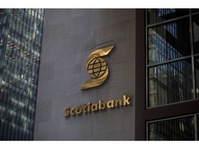 Bank of Nova Scotia signage is displayed outside Scotia Plaza in Toronto, Ontario, Canada, on Monday, Feb. 12, 2018. Bank of Nova Scotia agreed to buy Canadian money manager Jarislowsky Fraser Ltd. for about C$950 million ($755 million), helping push the bank toward its goal of getting more earnings from wealth management.