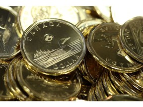 Canadian one dollar coins, also known as Loonies, sit in a pile at the Royal Canadian Mint Ltd. manufacturing facility in Winnipeg, Manitoba, Canada, on Monday, March 11, 2019. The Canadian dollar was steady against the greenback amid rising oil prices and mixed versus G-10 currencies as traders awaited domestic home price data Wednesday and a speech by the Bank of Canada's Carolyn Wilkins on Thursday. Photographer: Shannon VanRaes/Bloomberg