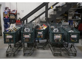Shopping carts filled with food sit at the Wood Buffalo Food Bank in Fort McMurray, Alberta, Canada, on Wednesday, Sept. 25, 2019. Once the booming heart of the country's energy industry, the little city of 75,000 in northeastern Alberta has become a showcase for the debt troubles many Canadians are facing. Photographer: Jason Franson/Bloomberg