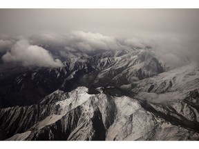 Clouds are seen above mountain glaciers in India.