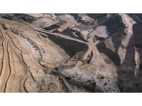 Excavation machinery at the Haizhou Open Pit Coal Mine in this aerial photograph taken in Fuxin, Liaoning province, China, on Monday, Nov. 16, 2020. When the Communist Party took over in 1949, leader Mao Zedong made Fuxin, where coal has been extracted since the 1700s, central to his efforts to modernize the nation. By 2005, easy-to-reach fuel was tapped out and the mine declared bankruptcy and Fuxin is still struggling to adapt.