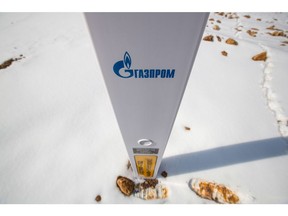 A branded marker post marking the Gazprom PJSC Power Of Siberia gas pipeline near Irkutsk, Russia, on Tuesday, April 6, 2021. Built by Russian energy giant Gazprom, the pipeline runs about 3,000 kilometers (1,864 miles) from the Chayandinskoye and Kovyktinskoye gas fields in the coldest part of Siberia to Blagoveshchensk, near the Chinese border. Photographer: Andrey Rudakov/Bloomberg